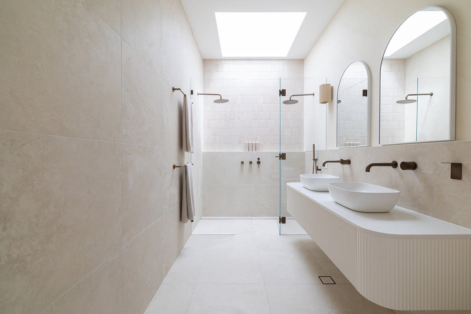Ensuite with double stone basins and walk-through shower