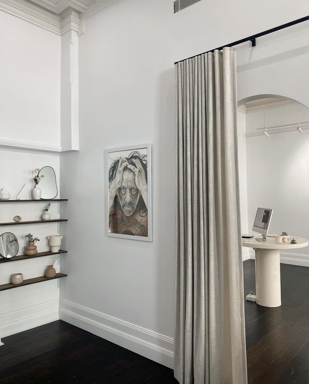 Retail shelving against the restored wall