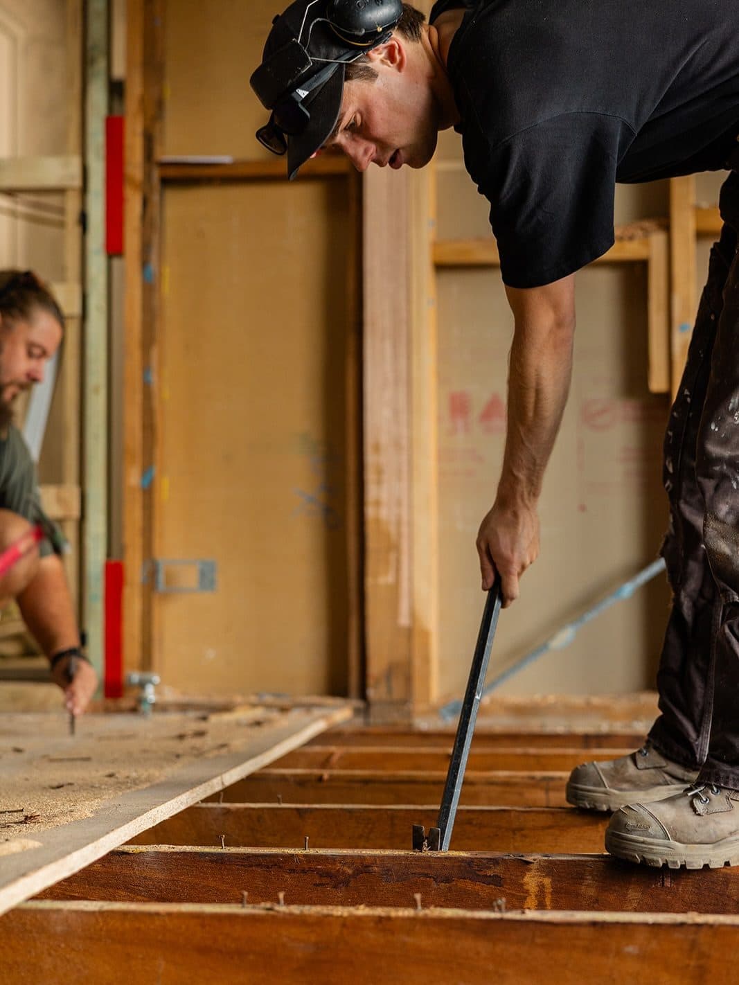 The MBC crew stripping out old flooring during a renovation