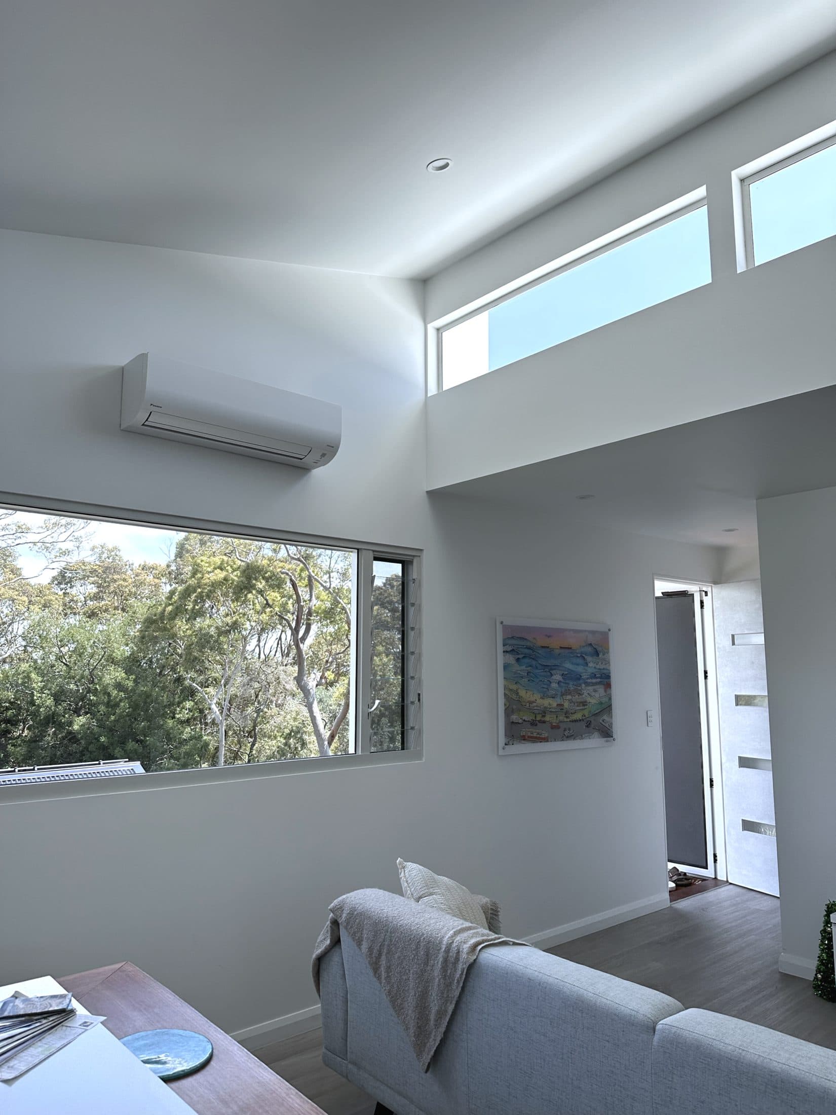 Lofted living space with highlight windows over the kitchen