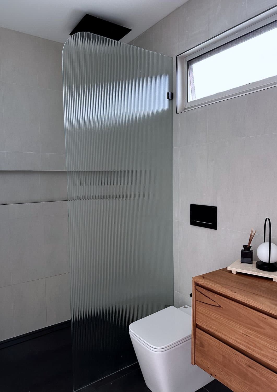 Powder room with timber wall-hung vanity