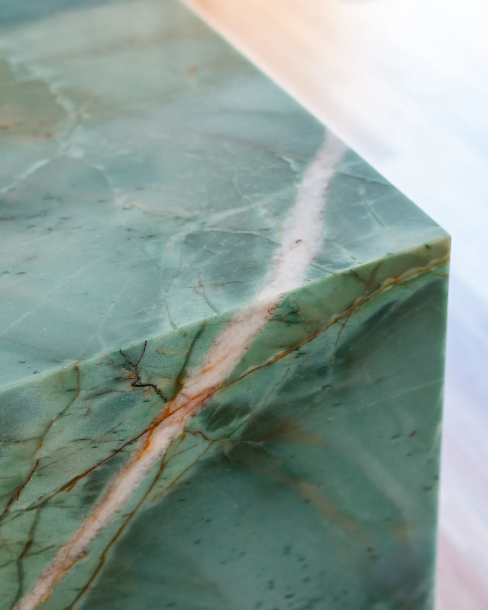 Green marble benchtop edge with copper veining