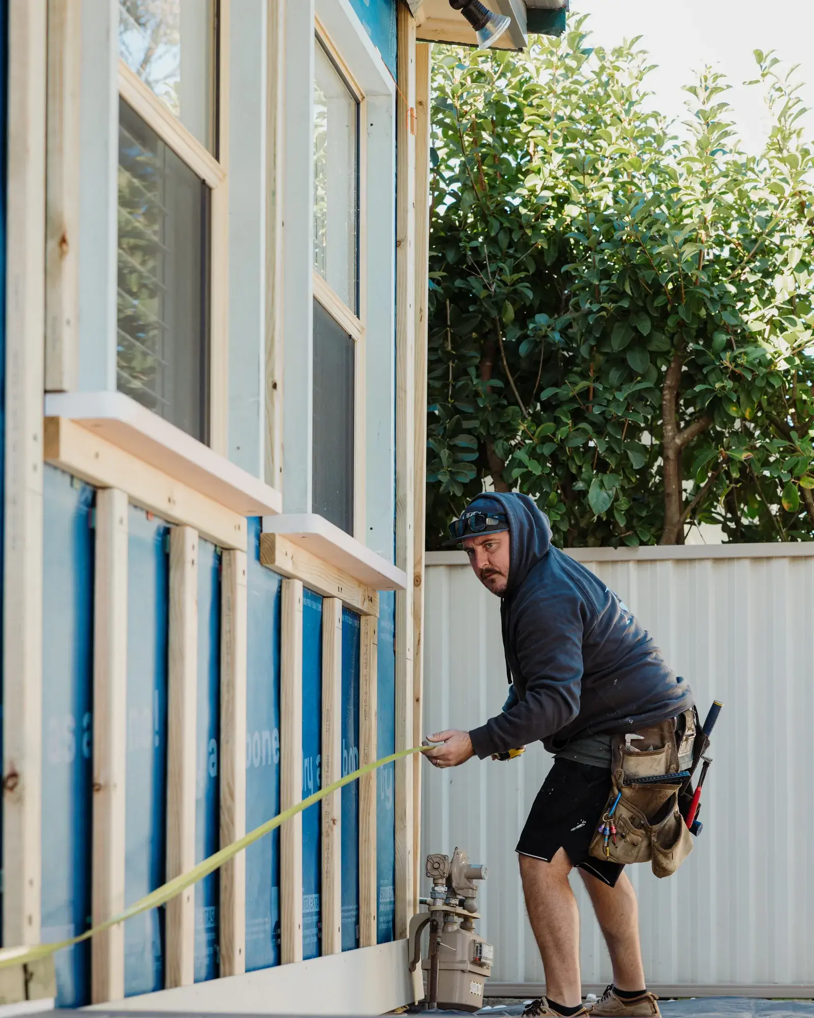 MBC carpenter setting out cladding boards at the Redhead renovation